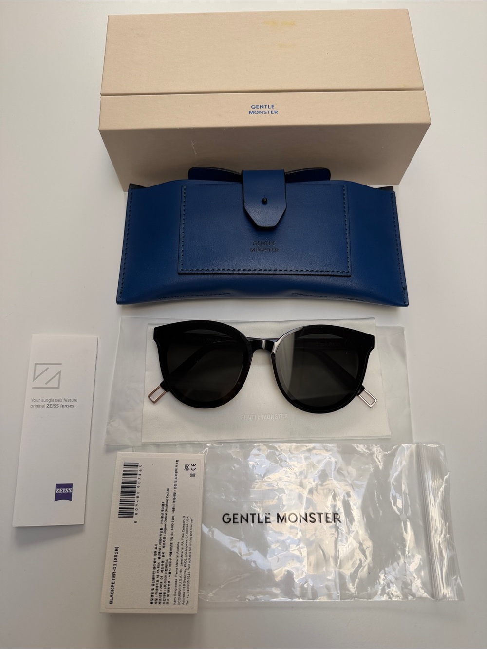GENTLE MONSTER Black Cat-Eye Sunglasses with Blue Case